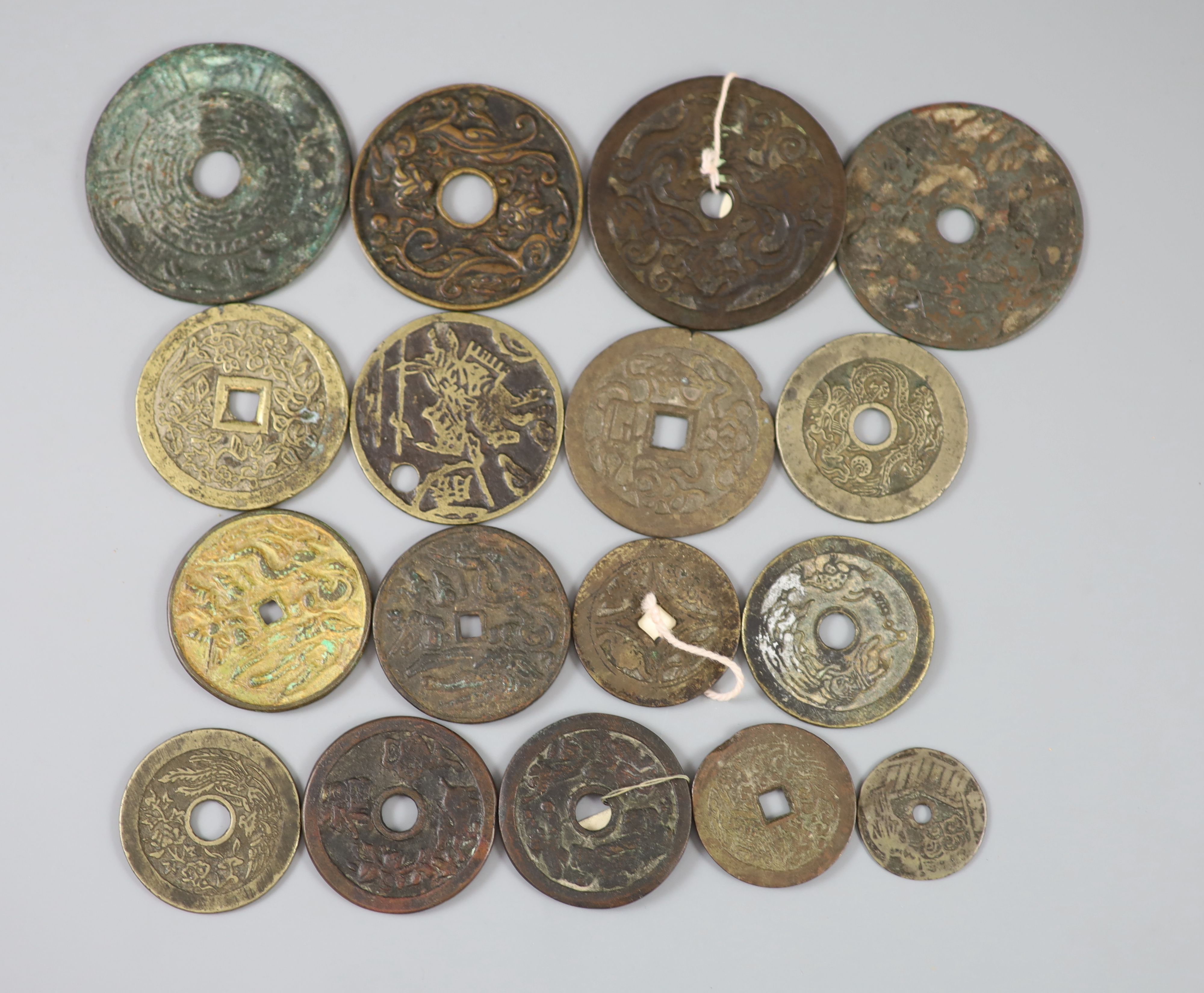 China, 17 bronze or copper charms or amulets, Qing dynasty or earlier,